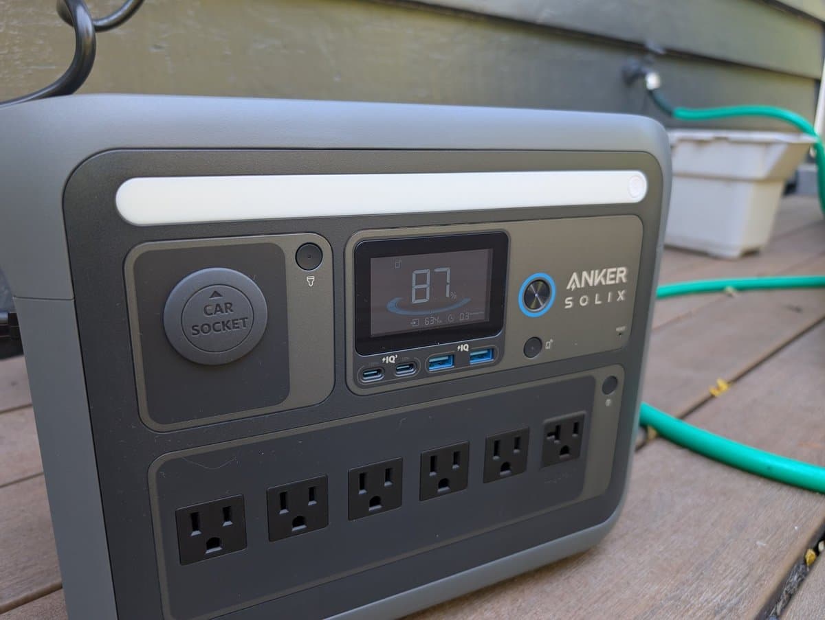 Anker SOLIX C1000 demonstrating portable size next to camping gear