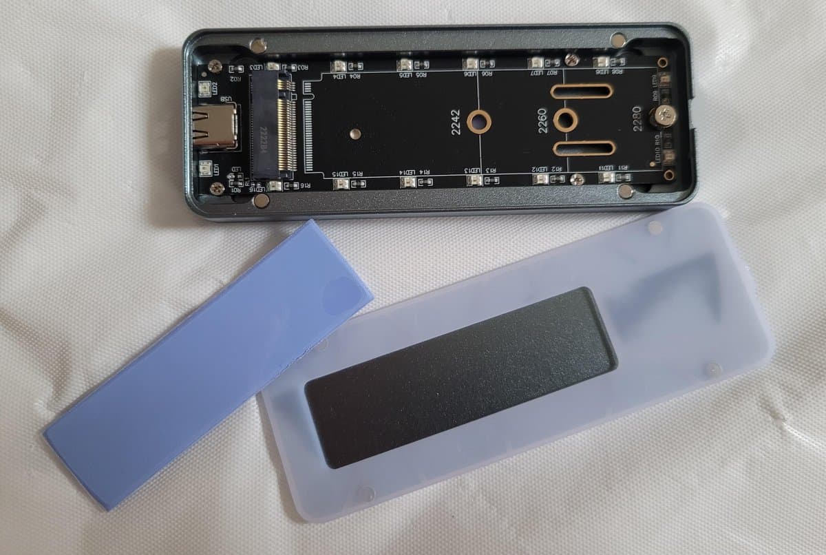 PNY CS2150 SSD with external enclosure showing installation and thermal pads