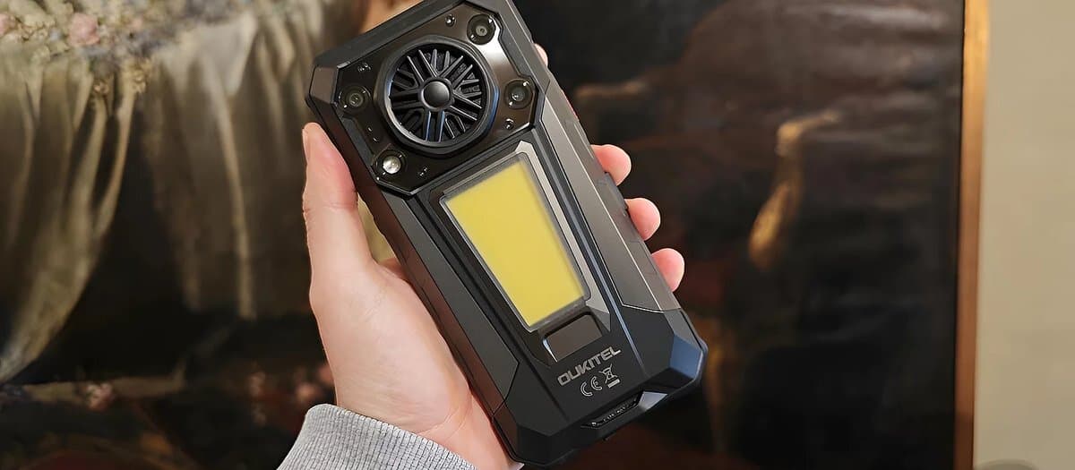 OUKITEL WP63 rugged smartphone with its built-in igniter feature demonstrated on outdoor camping equipment