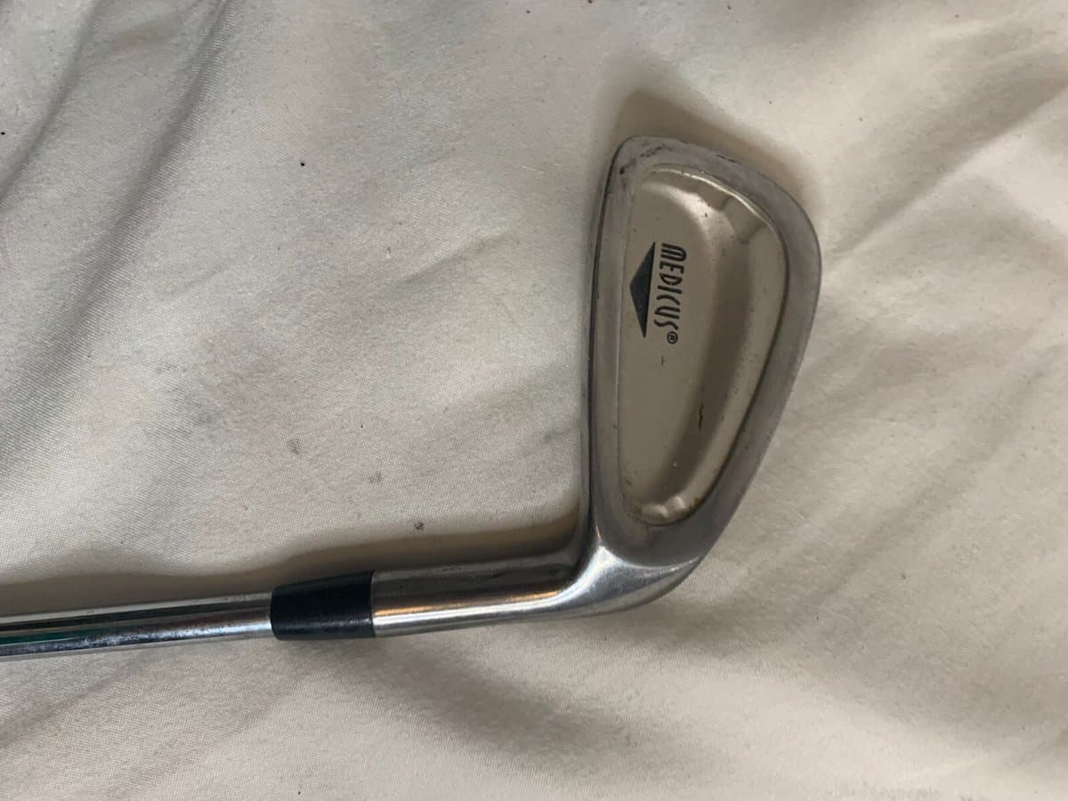 Medicus dual-hinge trainer showing hinged club design that provides swing plane feedback