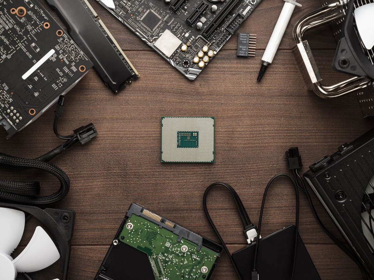 Gaming PC build components scattered on a workbench during the 2026 RAM shortage